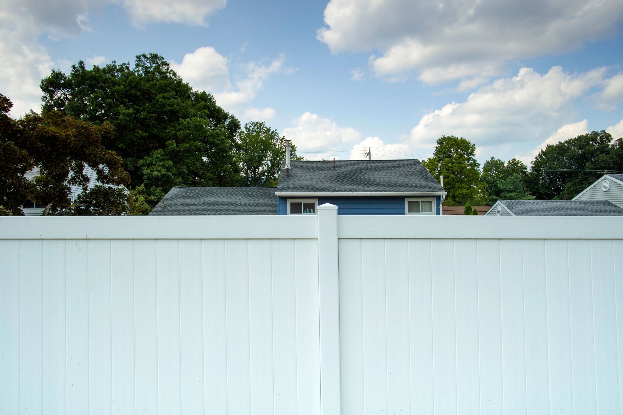 White picket fence in a residential neighborhood