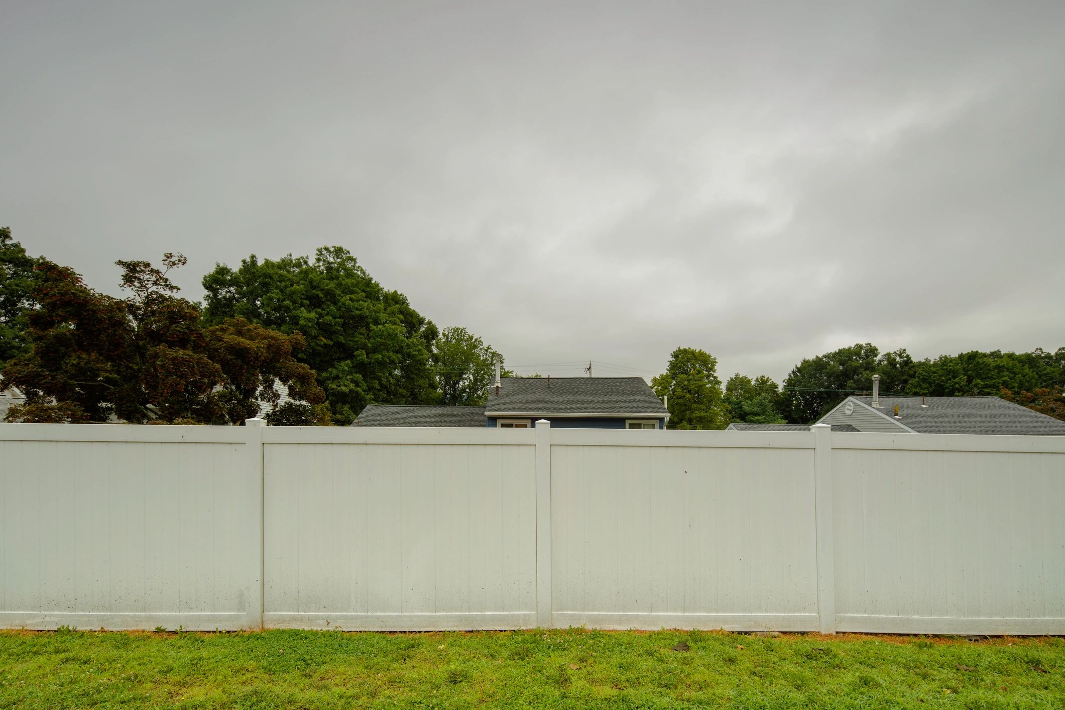 White vinyl-style picket fence