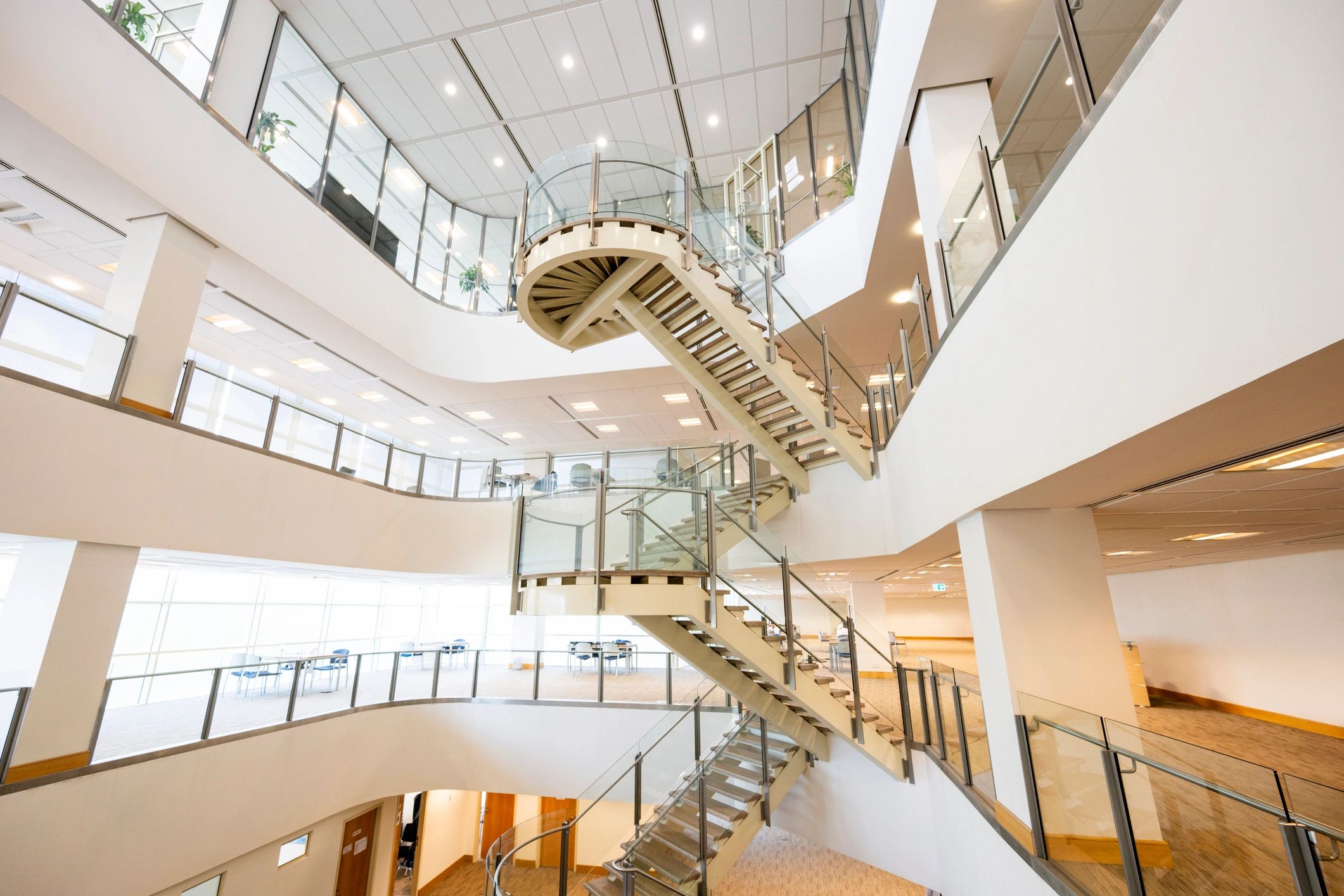 Bright and light atrium and staircase in library of modern university