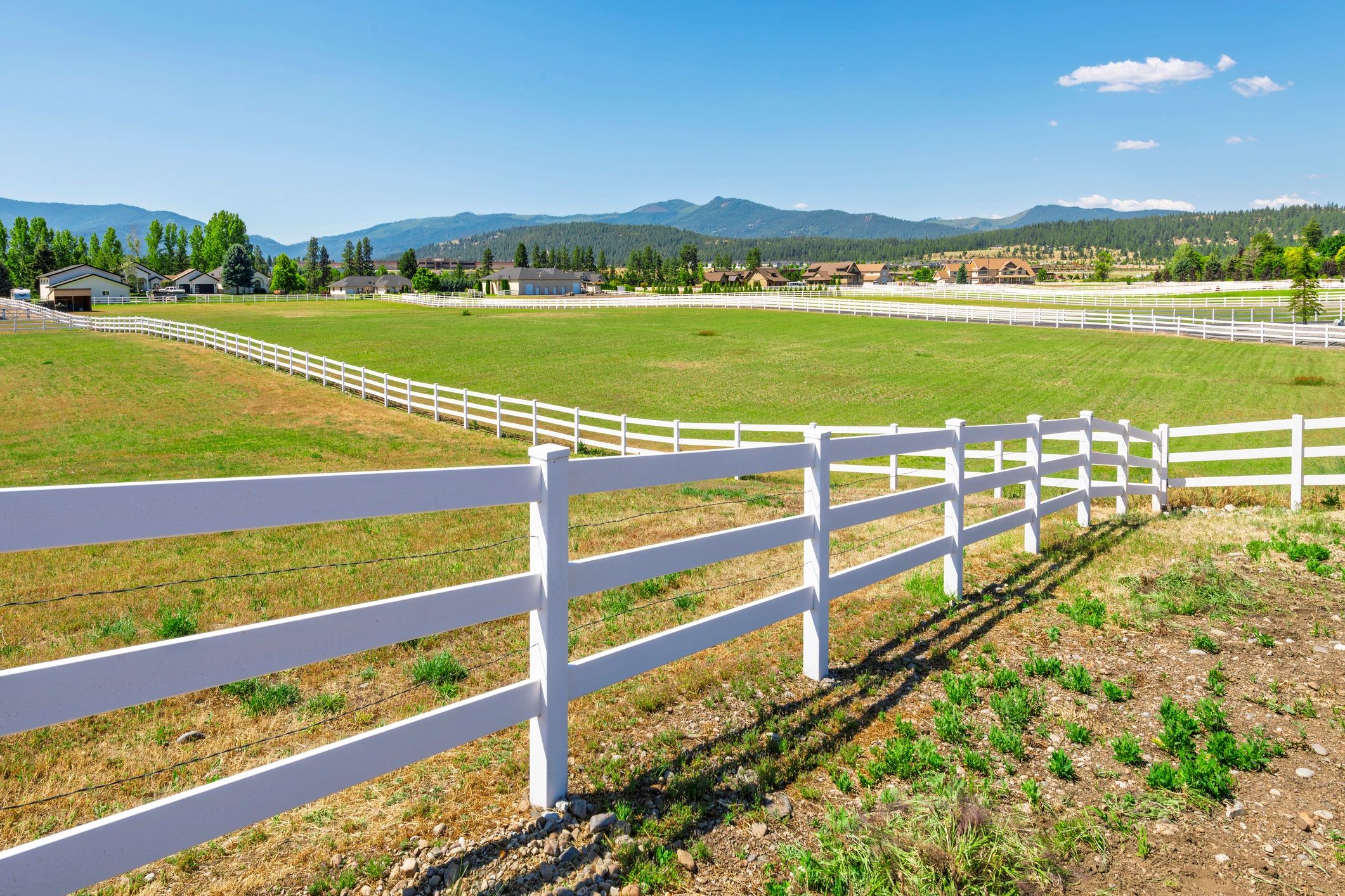 Vinyl rail fencing on a large property