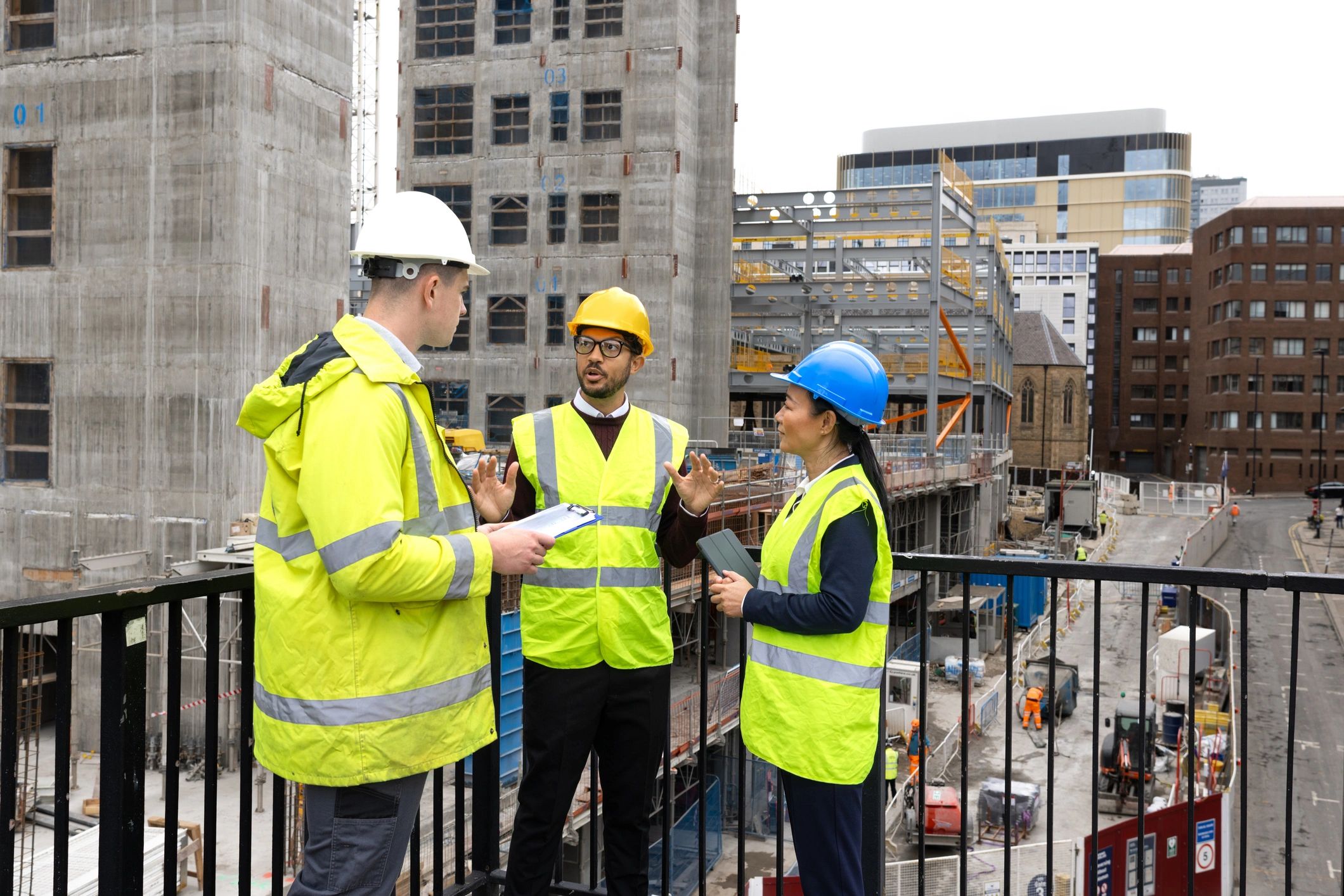 Construction team reviewing plans at a job site