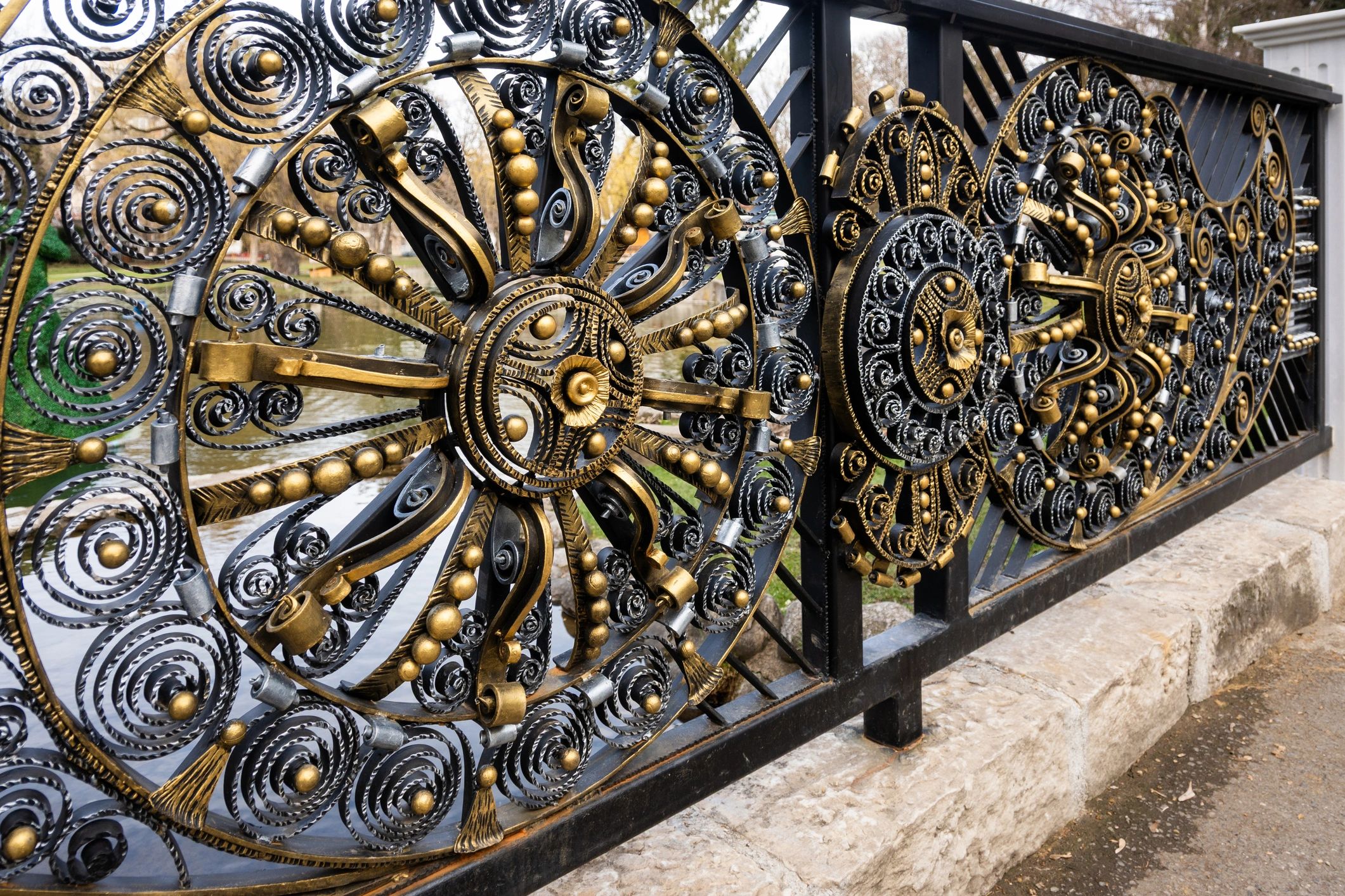 Ornate wrought iron fence along a walkway