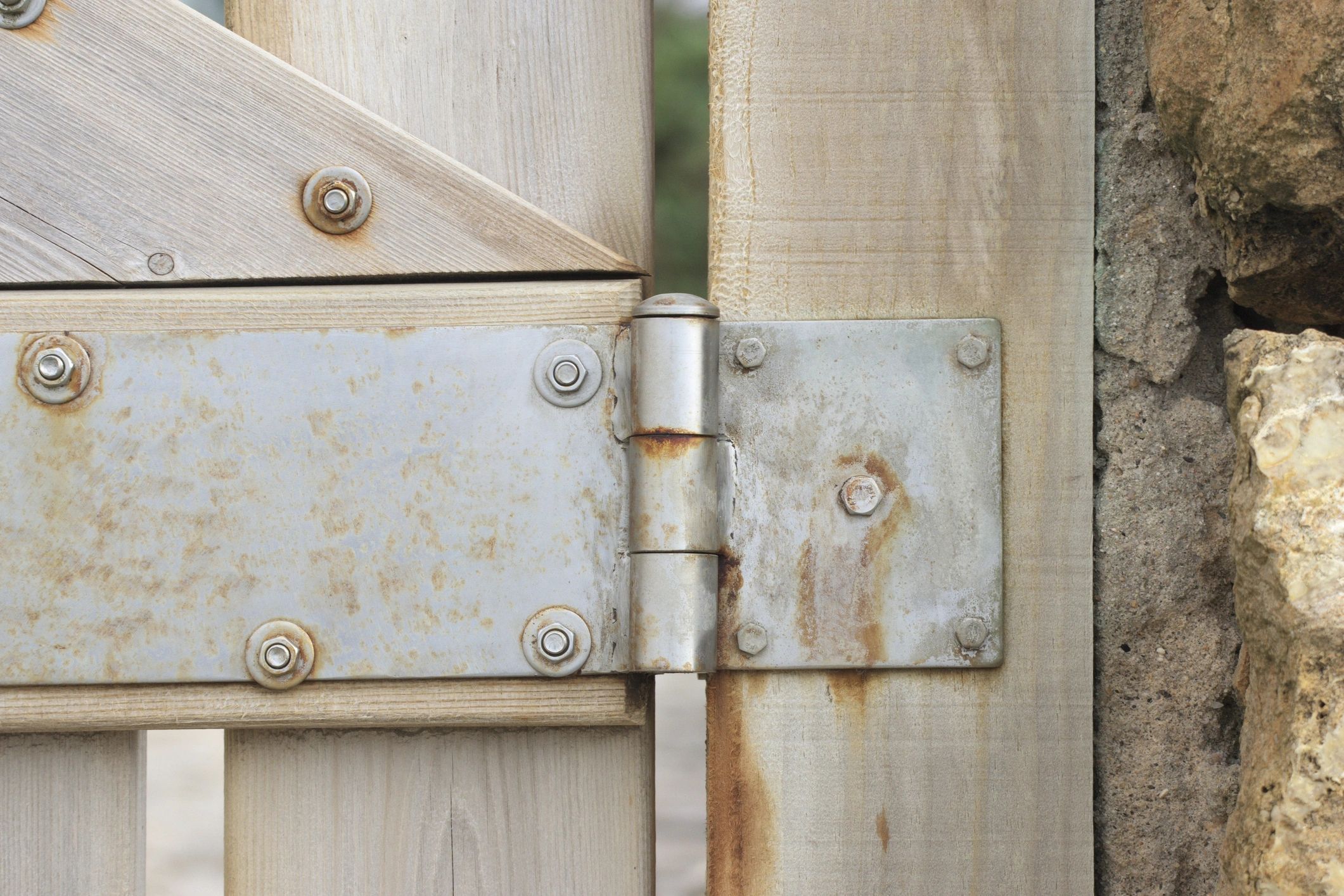 Close-up of gate hinge hardware detail